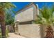 Exterior of home with off-white textured walls and roof with green trim, dish and palm trees at 9011 N 52Nd Ave, Glendale, AZ 85302