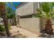Exterior of home with off-white textured walls and roof with green trim, dish and palm trees at 9011 N 52Nd Ave, Glendale, AZ 85302