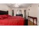 Bright main bedroom with walk-in closets, wood floors, and a ceiling fan at 9011 N 52Nd Ave, Glendale, AZ 85302