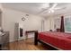 Spacious main bedroom with wood floors, ceiling fan, and large windows at 9011 N 52Nd Ave, Glendale, AZ 85302
