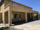 A covered backyard patio provides shade and respite, featuring decorative string lights and ceiling fans for added comfort at 9018 W Superior Ave, Tolleson, AZ 85353