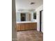 Bright bathroom with double sinks and vanities with plenty of lighting at 9018 W Superior Ave, Tolleson, AZ 85353