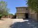 Two-story home featuring a tile roof, three-car garage, and a spacious driveway offers modern comfort at 9018 W Superior Ave, Tolleson, AZ 85353