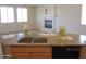 Kitchen with granite countertops, stainless steel sink, and modern appliances at 9018 W Superior Ave, Tolleson, AZ 85353