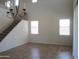 Open living room with tile floors, chandelier, and staircase at 9018 W Superior Ave, Tolleson, AZ 85353