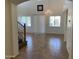 Bright, open-concept living room with high ceilings, tile floors, and ample natural light at 9018 W Superior Ave, Tolleson, AZ 85353