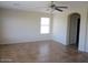 Empty living area with tile floor and an archway to another room at 9018 W Superior Ave, Tolleson, AZ 85353