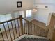 Bright, open living room with tile floors, large windows, and high ceilings with a chandelier at 9018 W Superior Ave, Tolleson, AZ 85353