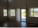 Open living room with tile floors, a slider to the backyard, and lots of natural light at 9018 W Superior Ave, Tolleson, AZ 85353