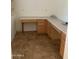Dedicated office space with custom built-in desk and tile flooring at 9018 W Superior Ave, Tolleson, AZ 85353