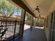 Covered outdoor patio with ceiling fans overlooking the backyard and pool area at 9018 W Superior Ave, Tolleson, AZ 85353
