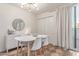 Dining room featuring contemporary chandelier, modern furniture, and seamless access to an outdoor balcony at 930 S Dobson Rd # 3, Mesa, AZ 85202