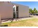 Exterior shot of building highlighting its contemporary design, landscaped grounds, and gated entrance at 930 S Dobson Rd # 3, Mesa, AZ 85202