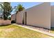 Modern townhouse featuring a flat roof, desert landscaping, and walkway to the private entry at 930 S Dobson Rd # 3, Mesa, AZ 85202