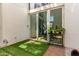 Private patio with decorative lighting and access to the home's interior at 930 S Dobson Rd # 3, Mesa, AZ 85202