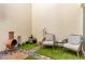 Enclosed patio with comfortable seating, gravel accents and vibrant desert landscaping at 930 S Dobson Rd # 3, Mesa, AZ 85202