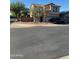Two story home featuring a light brown stucco exterior, terracotta roof, and two car garage at 9904 E Elena Ave, Mesa, AZ 85208