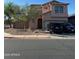 Charming two-story home featuring a light brown stucco exterior and a two car garage at 9904 E Elena Ave, Mesa, AZ 85208