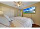 Bedroom showcasing a queen-sized bed, TV, and neutral tones for a relaxing atmosphere at 9926 W Gross Ave, Tolleson, AZ 85353