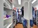Walk-in closet with custom shelves and ample storage space for shoes, clothes, and accessories at 9926 W Gross Ave, Tolleson, AZ 85353
