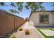 Stylish backyard featuring desert landscaping with pavers and artificial grass at 10240 E Supernova Dr, Mesa, AZ 85212