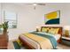 Bright bedroom featuring large windows, a ceiling fan, and stylish modern furniture at 10240 E Supernova Dr, Mesa, AZ 85212