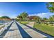 Scenic community park featuring a playground, walking path, picnic pavilion, and a peaceful pond view at 10240 E Supernova Dr, Mesa, AZ 85212