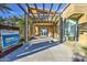 Welcoming entrance to the community clubhouse, featuring desert landscaping and modern architecture at 10240 E Supernova Dr, Mesa, AZ 85212