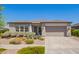 Charming single-story home featuring a well-maintained landscape and a neutral color scheme at 10240 E Supernova Dr, Mesa, AZ 85212