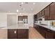 Gorgeous kitchen with island, modern appliances, sleek countertops, and stylish fixtures at 10240 E Supernova Dr, Mesa, AZ 85212