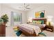 Stylish main bedroom with ceiling fan, large window, modern decor, and a neutral color palette at 10240 E Supernova Dr, Mesa, AZ 85212