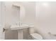 Clean, half-bath with white fixtures and modern design at 10240 E Supernova Dr, Mesa, AZ 85212