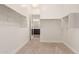 Spacious walk-in closet with custom shelving and clothing rods, leading into the primary bathroom at 10240 E Supernova Dr, Mesa, AZ 85212