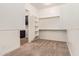 Expansive walk-in closet with adjustable shelving, offering ample storage space and organization at 10240 E Supernova Dr, Mesa, AZ 85212