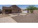 Backyard of a home with rock landscaping, and a shed offers easy maintenance at 10618 W Pima St, Tolleson, AZ 85353