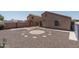 Aerial view of backyard with rock landscaping, and a surrounding brick wall offers easy maintenance at 10618 W Pima St, Tolleson, AZ 85353