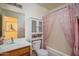 This bathroom features a sink, toilet, bathtub, and a cabinet for storage at 10618 W Pima St, Tolleson, AZ 85353
