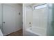 Clean bathroom featuring tiled shower with window and shower door at 10618 W Pima St, Tolleson, AZ 85353