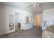 Spacious bedroom features a ensuite bathroom, neutral walls, and carpeted floor at 10618 W Pima St, Tolleson, AZ 85353