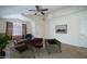 Staged living room with comfortable seating arrangements at 10618 W Pima St, Tolleson, AZ 85353