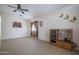 Spacious living room with tile flooring and a ceiling fan at 10618 W Pima St, Tolleson, AZ 85353