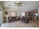 Open-concept living room provides seamless flow into the kitchen and dining area at 10618 W Pima St, Tolleson, AZ 85353
