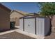 Backyard shed provides extra storage space, complementing the property's functionality and appealing backyard at 10618 W Pima St, Tolleson, AZ 85353