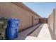 Clean side yard with gravel accents, offering a tidy and low-maintenance outdoor space at 10618 W Pima St, Tolleson, AZ 85353