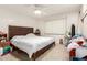 Cozy bedroom featuring carpet floors, natural light, and a comfortable bed at 10651 W Saratoga Cir, Sun City, AZ 85351