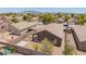 Aerial view of backyard featuring gravel landscaping, block fence, and covered patio at 16264 W Pioneer St, Goodyear, AZ 85338