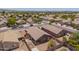 View of home in a neighborhood setting, with gravel landscaping, block fence, and covered patio at 16264 W Pioneer St, Goodyear, AZ 85338