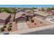 An elevated view of the house, showing desert landscaping and proximity to other homes at 16264 W Pioneer St, Goodyear, AZ 85338