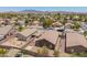 View of home in a neighborhood setting, with gravel landscaping, block fence, and covered patio at 16264 W Pioneer St, Goodyear, AZ 85338