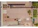 An elevated shot of this property shows the backyard with desert landscaping, a patio, and a garden at 16264 W Pioneer St, Goodyear, AZ 85338